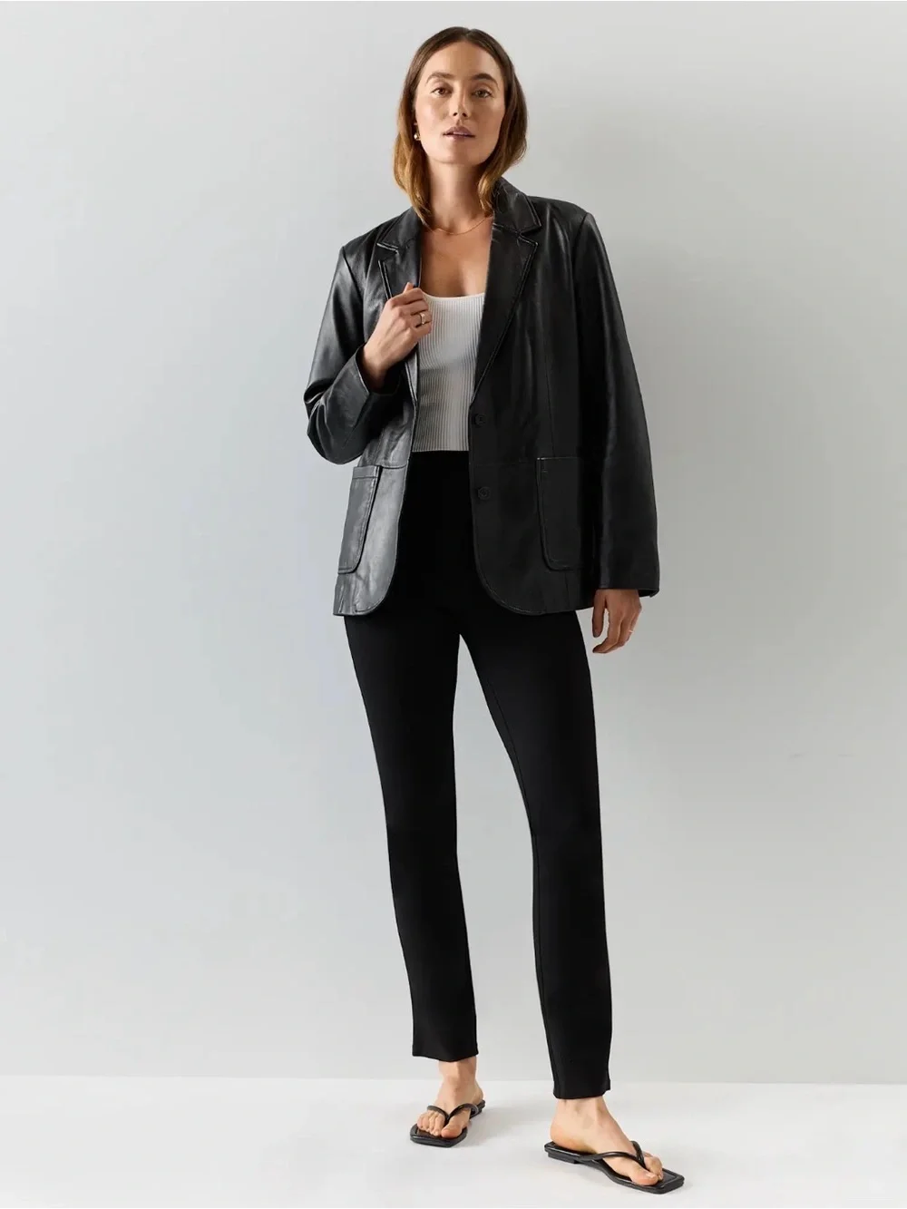 Quince black ultra stretch ponte straight leg pants. Size medium petite.